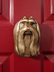 Maltese Door knocker on red door